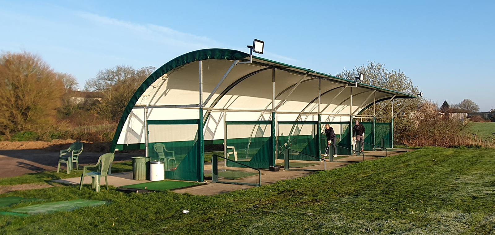 Driving range practice bays used for coaching at The Notleys