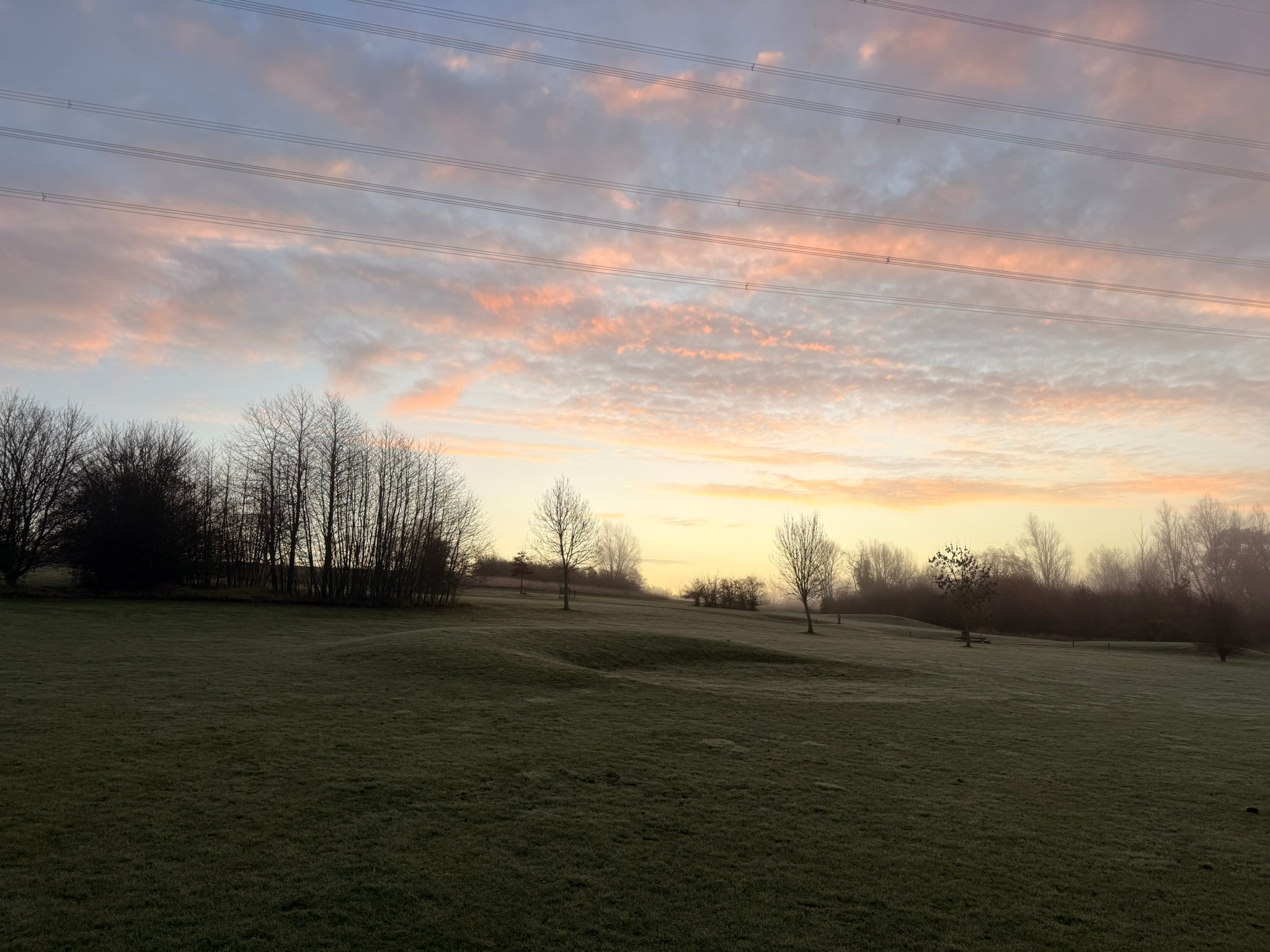 Golf bag beside the course in late evening light at The Notleys